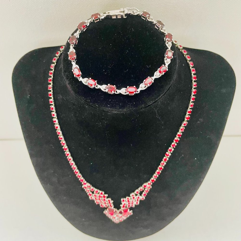Sterling silver genuine garnet tennis bracelet, & a garnet silver tone necklace